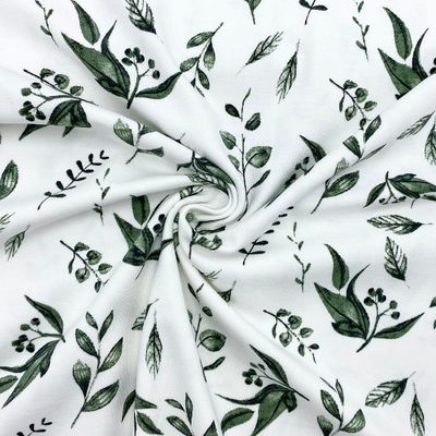 Jerseystoff, Organic, Baumwolle. grüne Blätter auf weißem Hintergrund